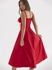 The new summer dress for women features a cinched waist and a split halter